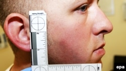 На фотографии изображен полицейский Даррен Уилсон и его раны, полученные во время драки с афро-американским подростком Майклом Брауном