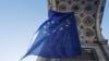 The Belgian Council presidency raises a giant EU flag under the Cinquantenaire Arch, in Brussels on January 19, 2024.