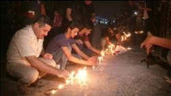 В Багдаде почтили память жертв недавних взрывов В Багдаде почтили память жертв недавних взрывов