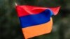 TOPSHOT - A child waves an Armenian flag as Armenians protest against Azerbaijan's offensive in Nagorno-Karabakh, at Place du Canada in Montreal, Quebec, Canada, on October 1, 2023.