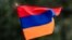 TOPSHOT - A child waves an Armenian flag as Armenians protest against Azerbaijan's offensive in Nagorno-Karabakh, at Place du Canada in Montreal, Quebec, Canada, on October 1, 2023.