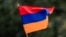TOPSHOT - A child waves an Armenian flag as Armenians protest against Azerbaijan's offensive in Nagorno-Karabakh, at Place du Canada in Montreal, Quebec, Canada, on October 1, 2023.
