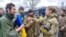 Ukrainian POWs are seen after swap at unknown location in Ukraine